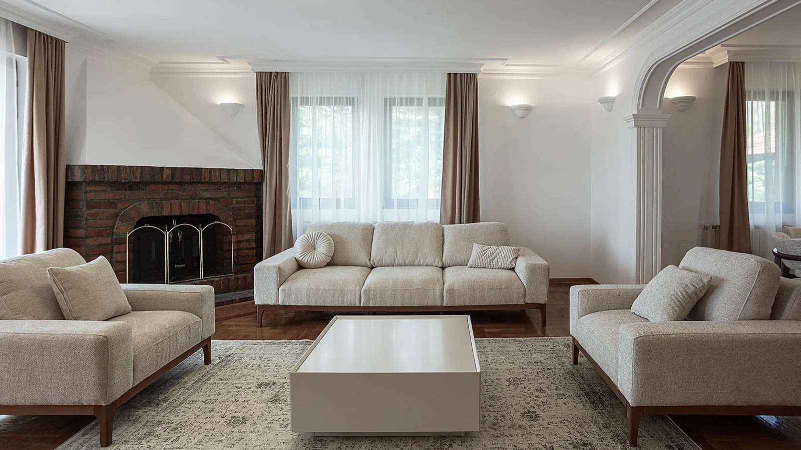 BP77 living room with neutral seating, ornamental parquet and the original brick fireplace