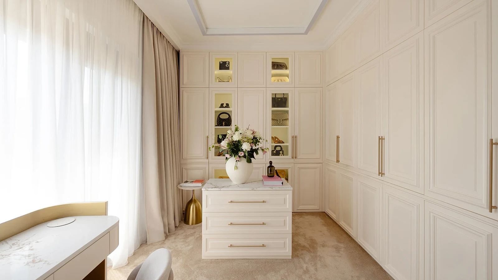 MBS Master Suite dressing room with ivory panelled wardrobes, illuminated niches and central dresser