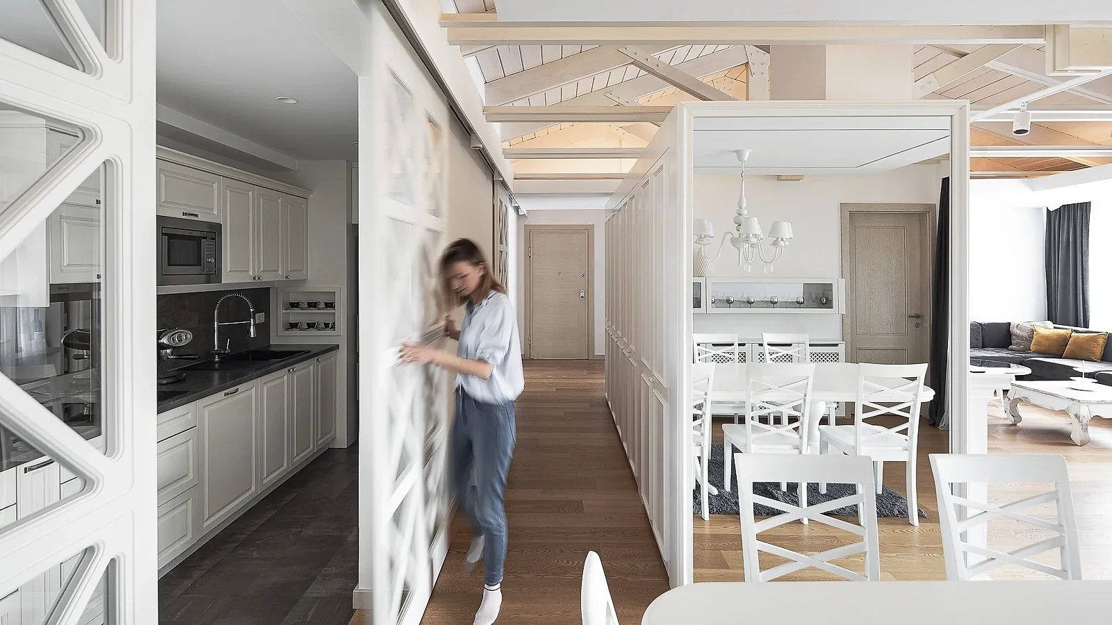 S27 Apartment kitchen and dining area with white joinery and exposed timber roof structure