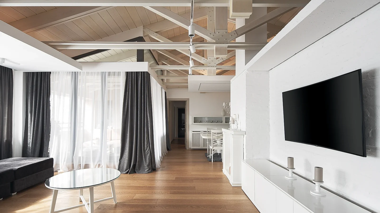 White media wall and floating ceiling details in the S27 Apartment living room
