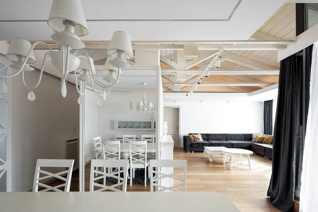 Layered floating ceiling planes connecting the S27 dining and living areas