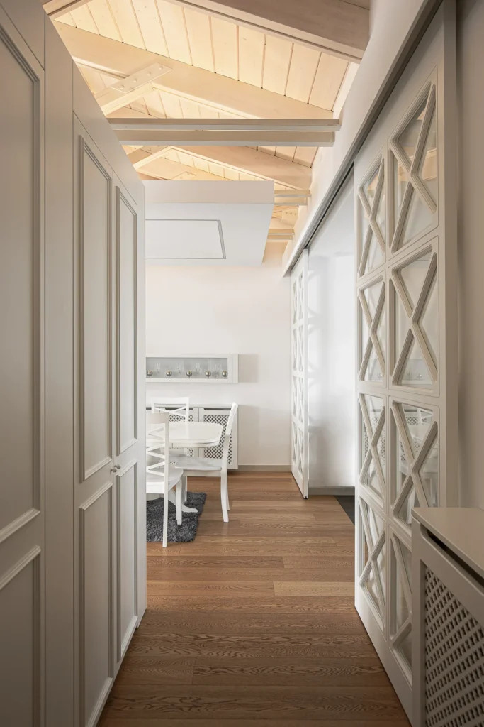 S27 corridor with custom lattice shelving and views toward the dining room