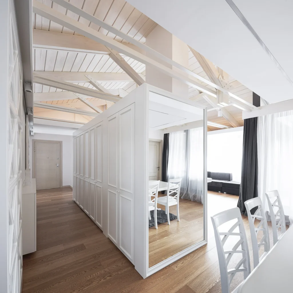 Mirrored wall expanding the corridor between the S27 living and dining areas