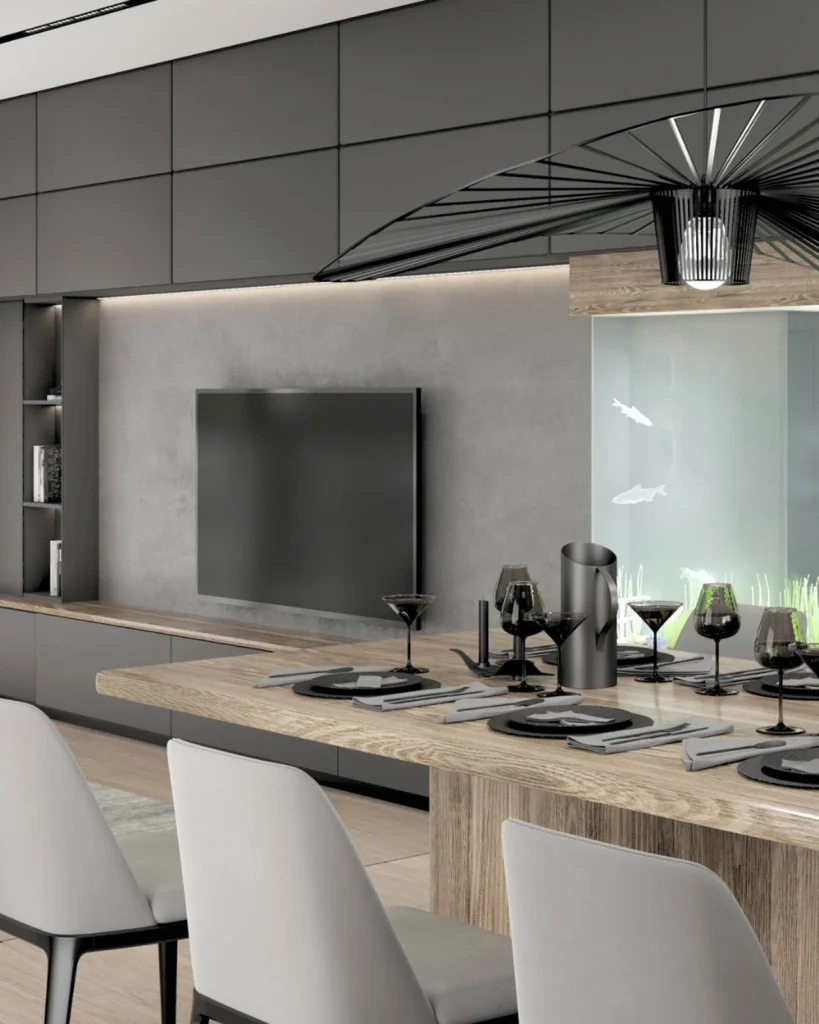 Kovačevac House dining area beside a dark media wall and integrated aquarium