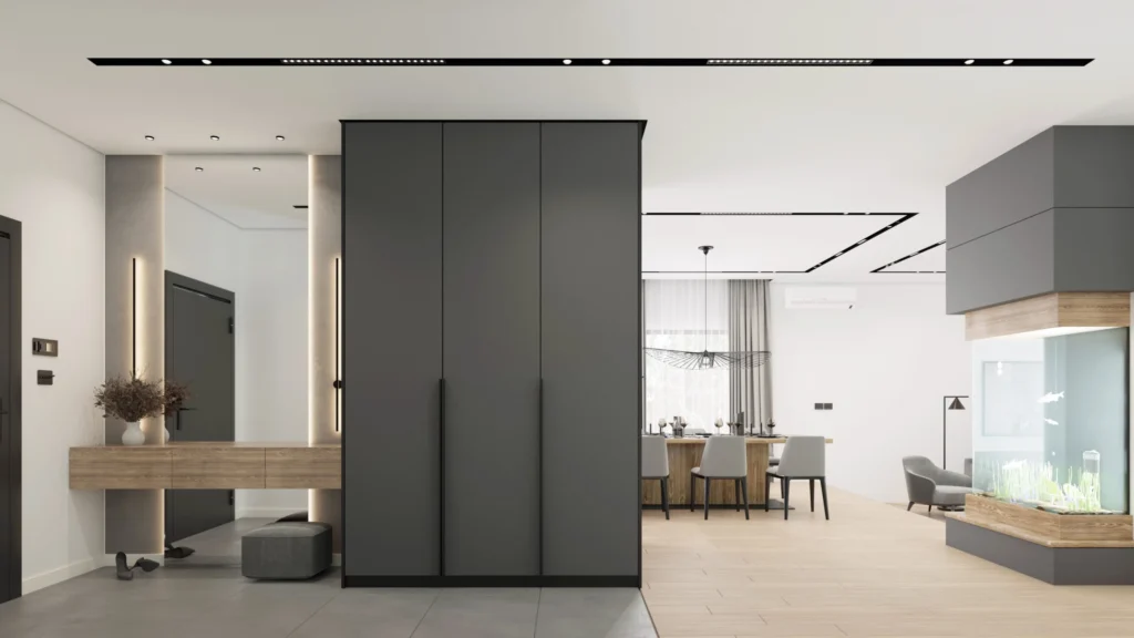 Open-plan Kovačevac House interior with a central dark storage volume and framed views to the dining area