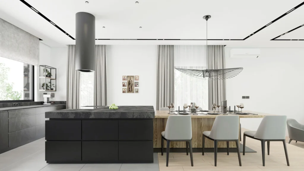 Kovačevac House kitchen and dining area with dark cabinetry, pale surfaces and garden views