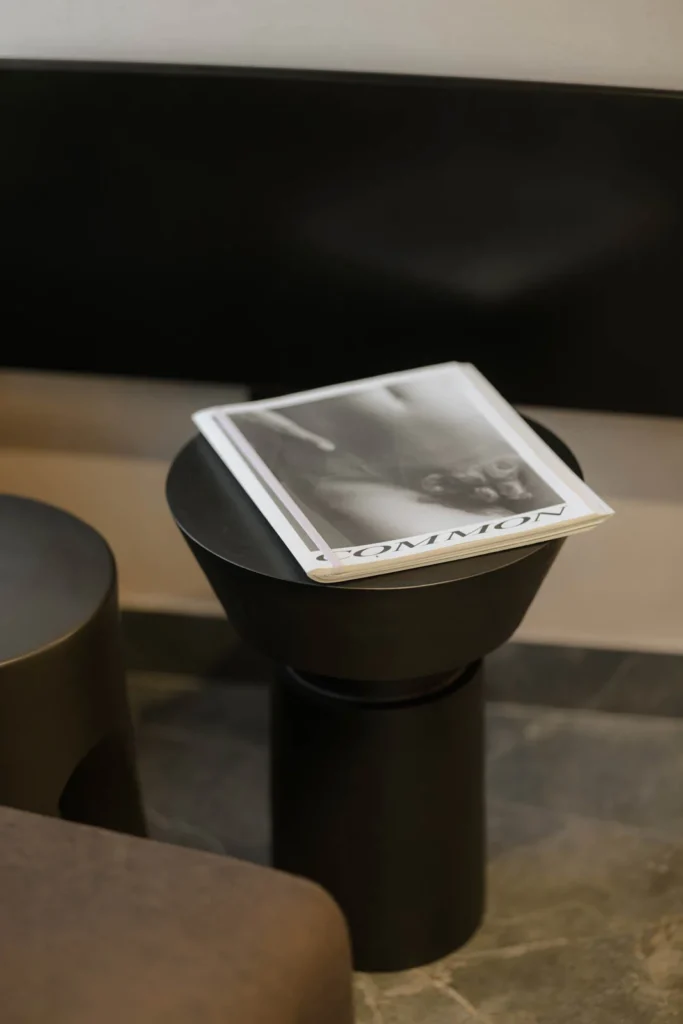 Black freestanding wash basin in the dark-toned hair washing area at L'Atelier 35