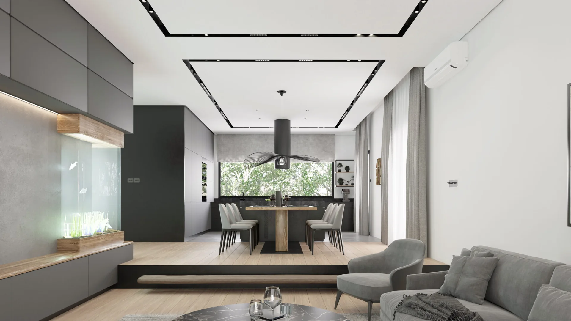 Split-level Kovačevac House living area with an integrated aquarium and open kitchen beyond