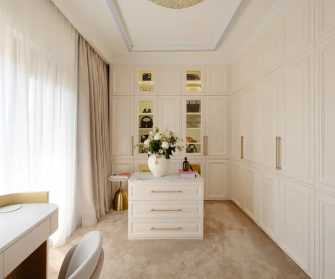 MBS Master Suite dressing room with ivory panelled wardrobes, illuminated niches and central dresser