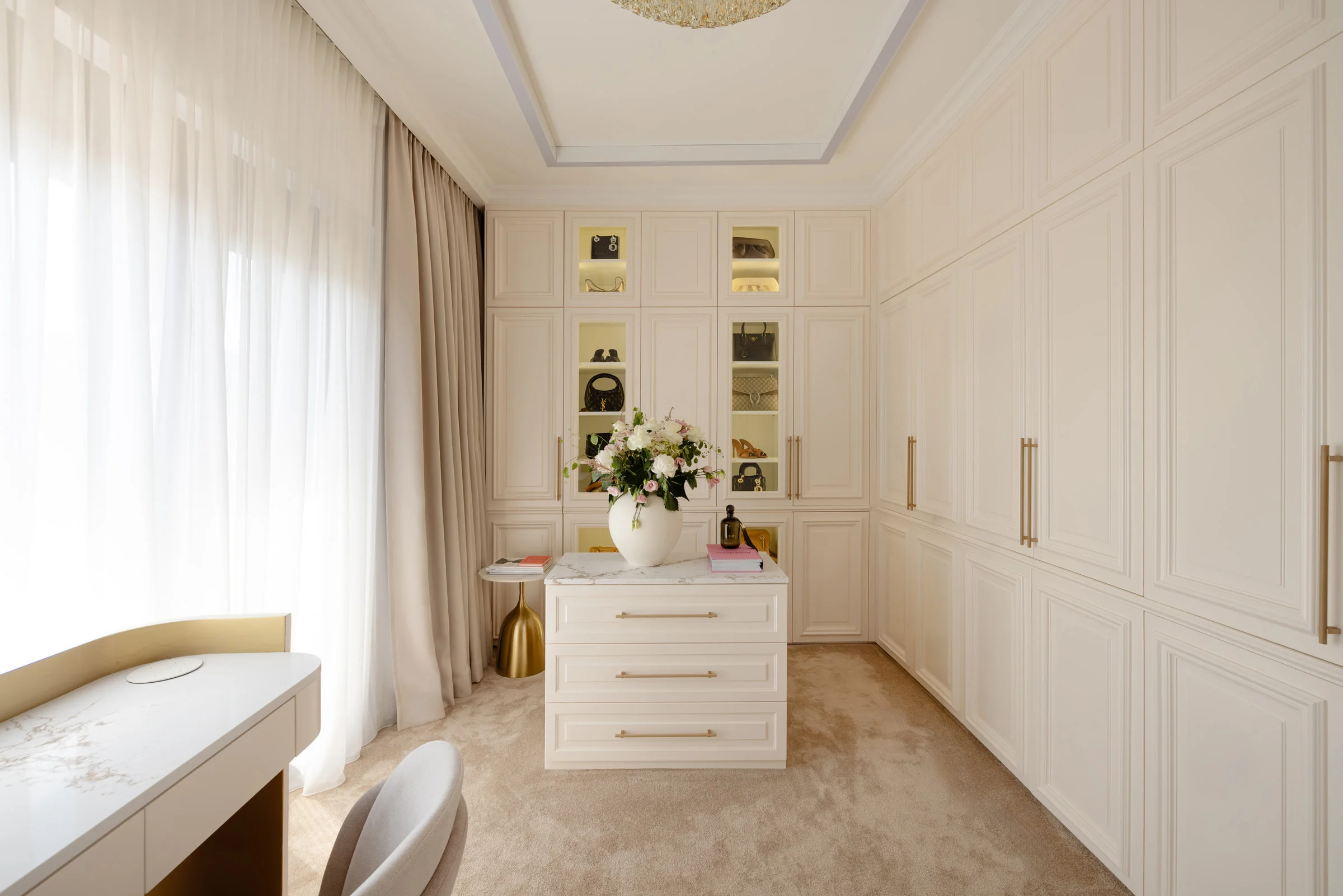 MBS Master Suite dressing room with ivory panelled wardrobes, illuminated niches and central dresser