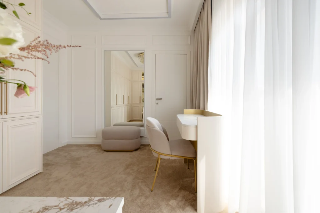 MBS Master Suite curved vanity beside layered curtains and a full-height mirror