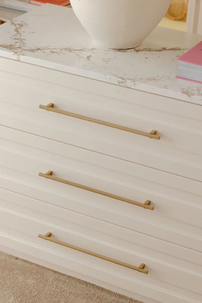 MBS Master Suite movable central dresser with pale stone top and brass handles