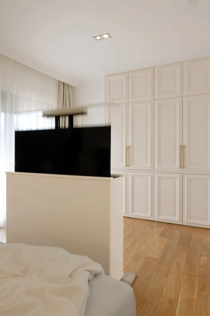 MBS Master Suite bedroom with concealed lift-up television and panelled wardrobes